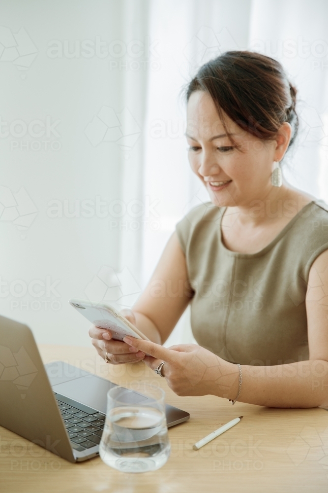 A woman working from home - Australian Stock Image