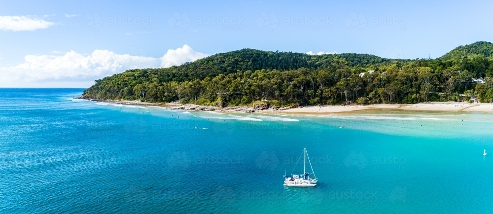 A yacht anchored off Noosa Heads, Queensland. - Australian Stock Image