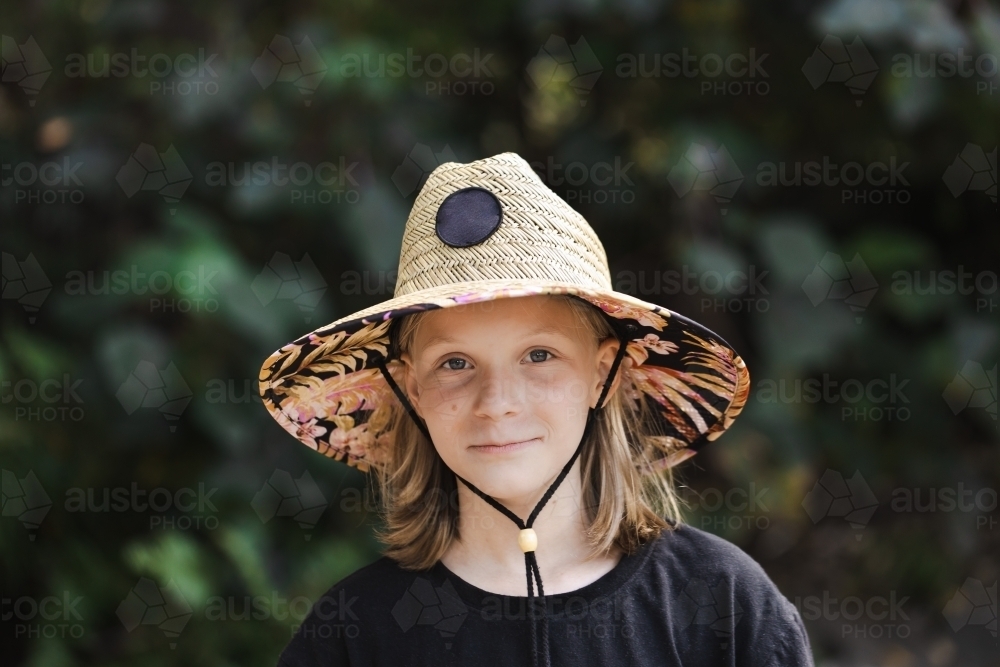 A young australian 11 year old girl wearing a sun smart wide brimmed hat - Australian Stock Image