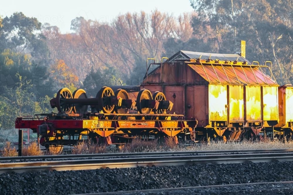 Abandoned railway carriages on a frosty Winters morning - Australian Stock Image