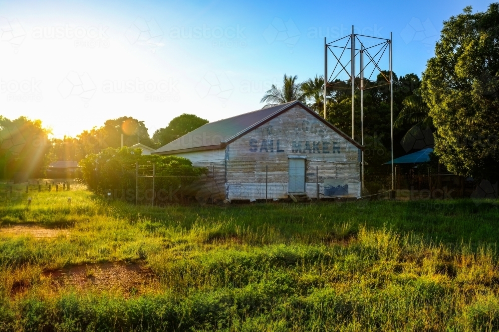 Abandoned sail maker shed at sunset - Australian Stock Image