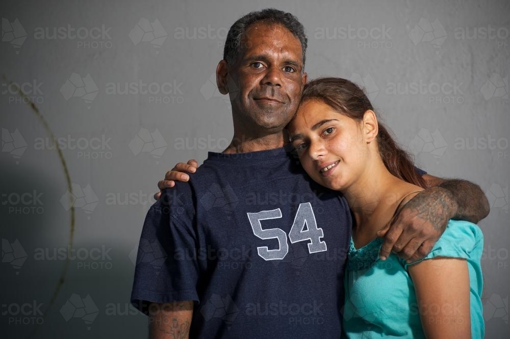 Aboriginal Australian Man and Woman Hugging - Australian Stock Image