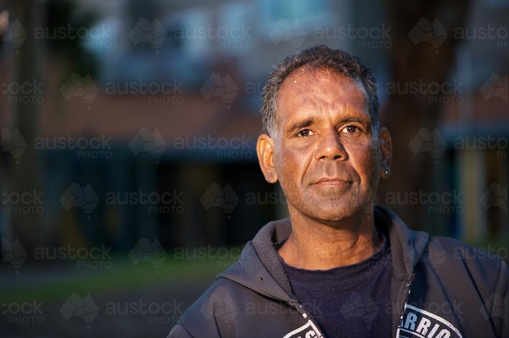 Aboriginal Australian Man wearing a black hoodie - Australian Stock Image