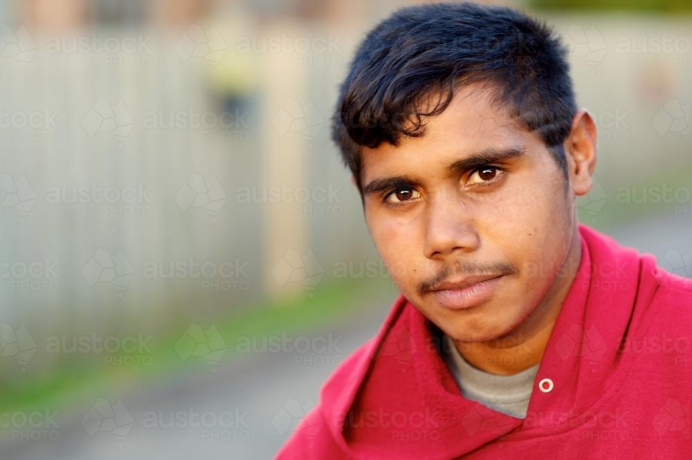 Aboriginal Australian Teenager in Red Hoodie - Australian Stock Image