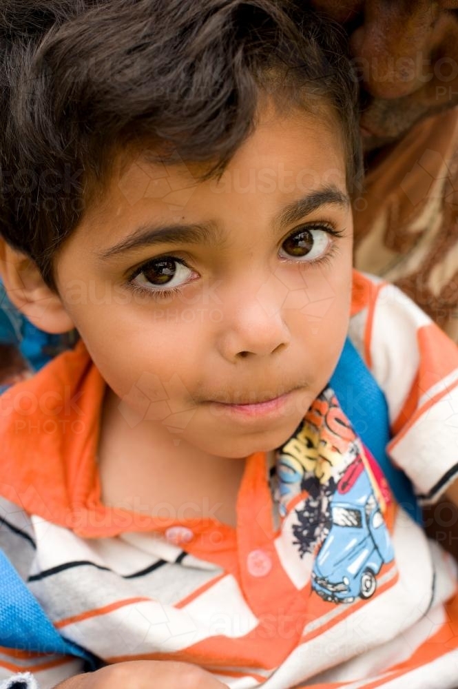Aboriginal Boy Looking up at Camera - Australian Stock Image