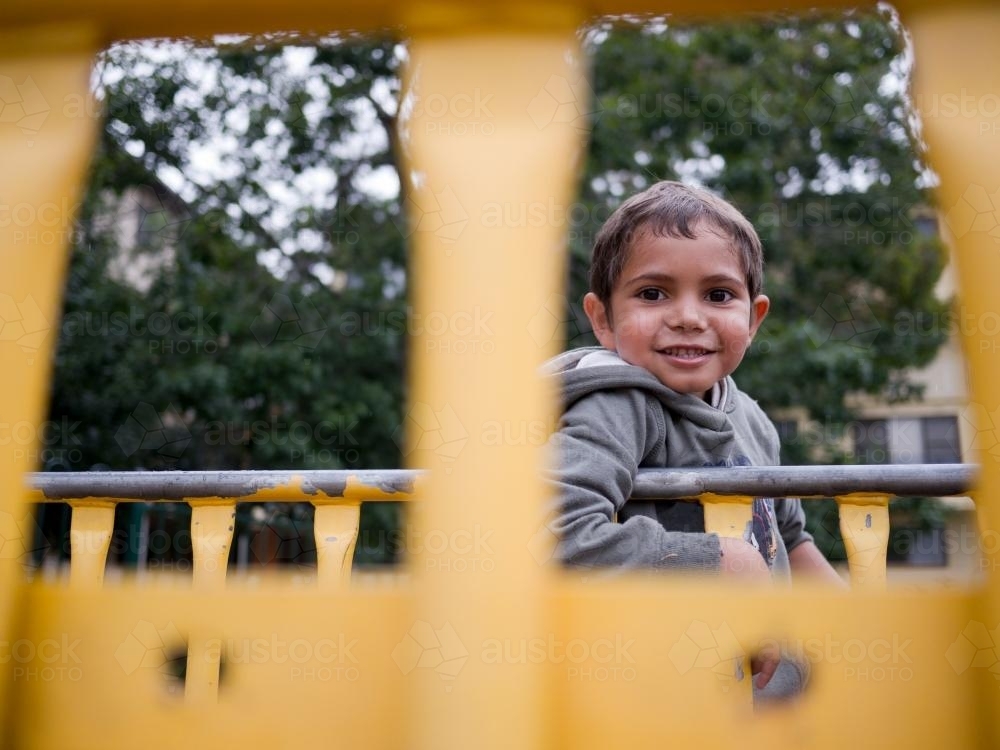 Aboriginal Boy on Playground Equipment - Australian Stock Image