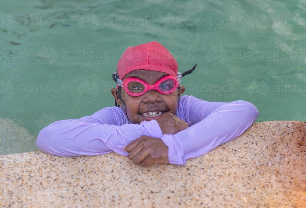 Aboriginal child in the pool - Australian Stock Image