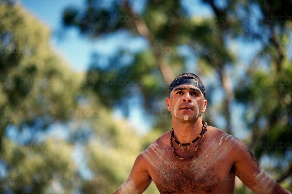 Aboriginal Dancer Against Blurred Background - Australian Stock Image