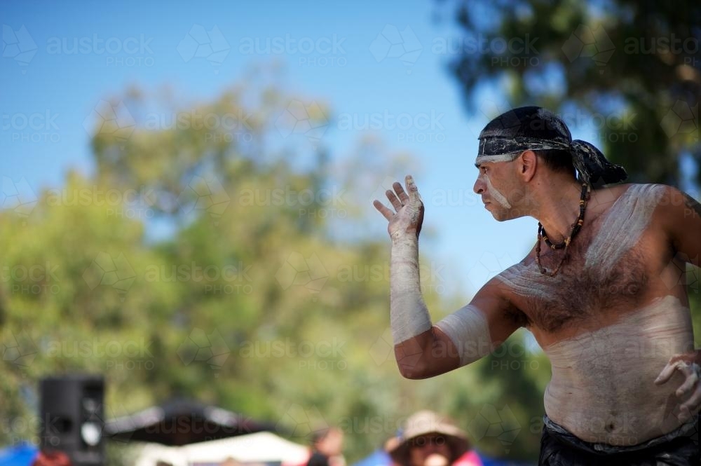 Aboriginal Dancer Emerging from Shadow - Australian Stock Image