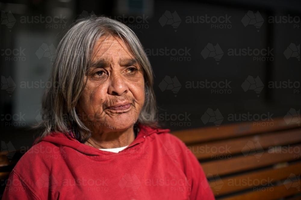 Aboriginal Elder in Red Top - Australian Stock Image