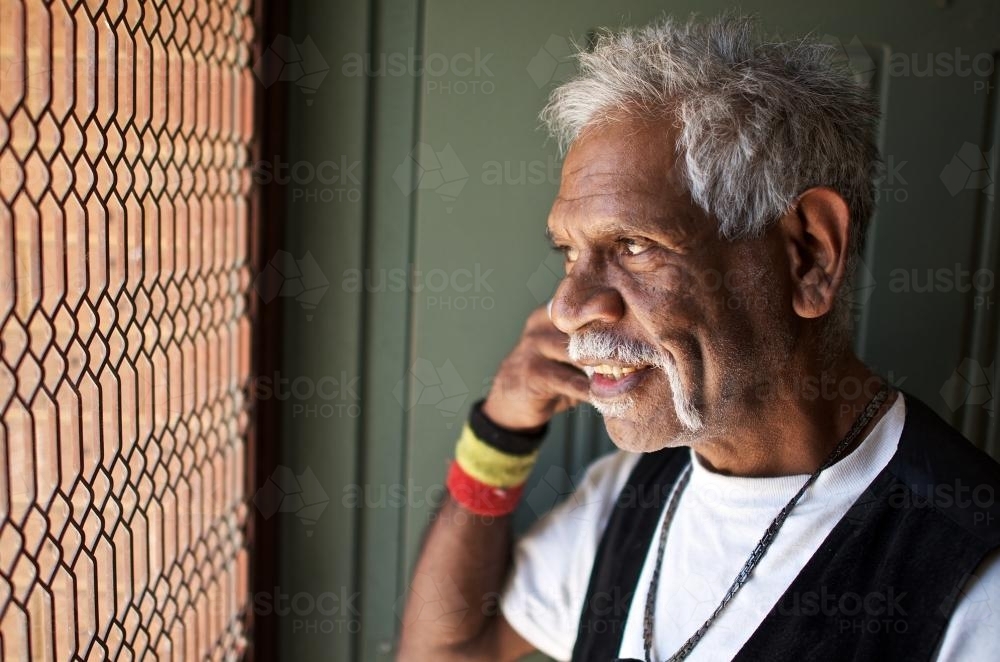 Aboriginal Elder near Front Door - Australian Stock Image