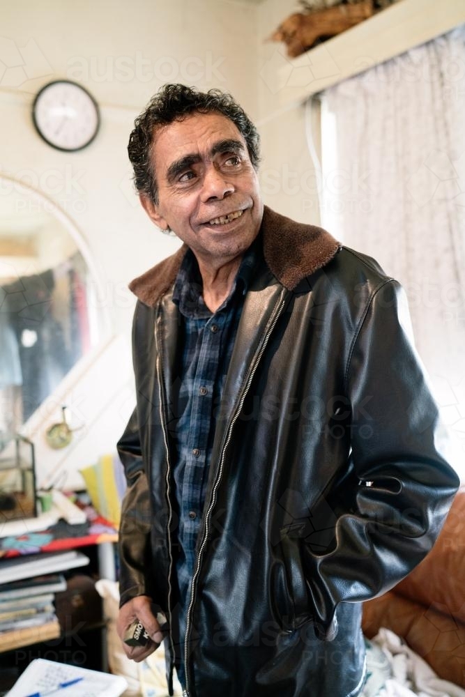 Aboriginal Elder Standing Indoors - Australian Stock Image