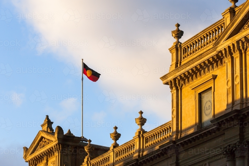 aboriginal flag flying above a heritage buildings - Australian Stock Image