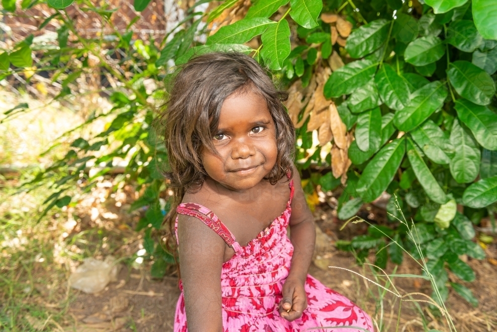 Aboriginal girl in the garden - Australian Stock Image