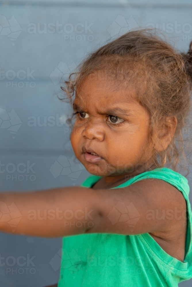 Aboriginal girl toddler pointing - Australian Stock Image