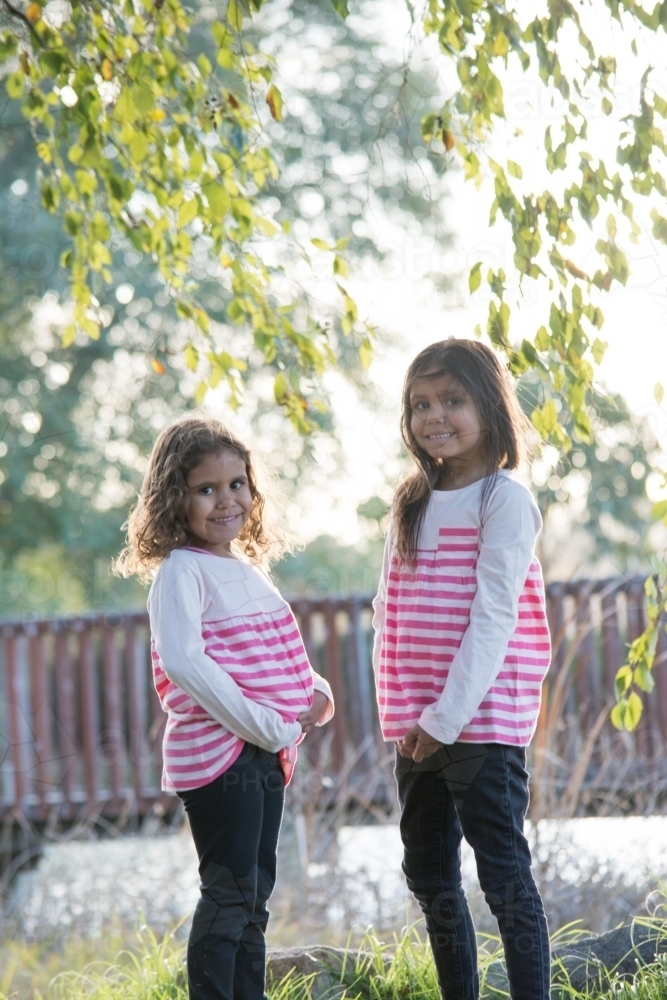 Aboriginal girls together outside - Australian Stock Image