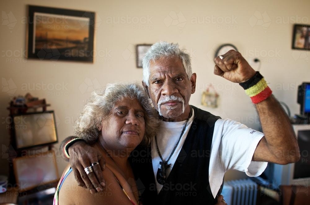 Aboriginal Man and Woman Standing Proudly in Living Room - Australian Stock Image