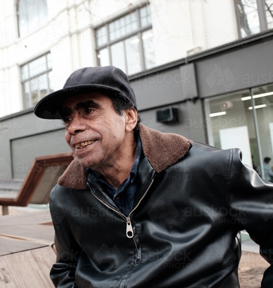 Aboriginal Man Smiling in an Urban Location - Australian Stock Image
