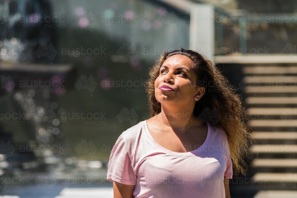 aboriginal woman in the bright sun - Australian Stock Image