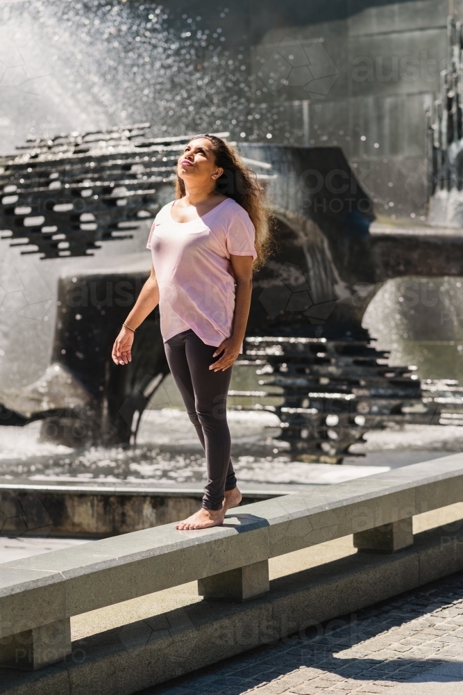 aboriginal woman in the bright sun - Australian Stock Image