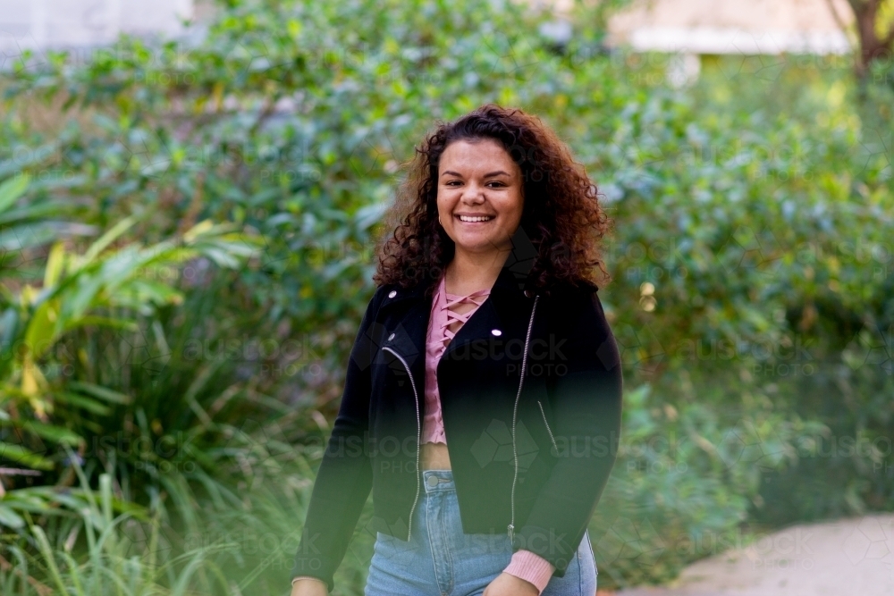 aboriginal woman walking outside - Australian Stock Image