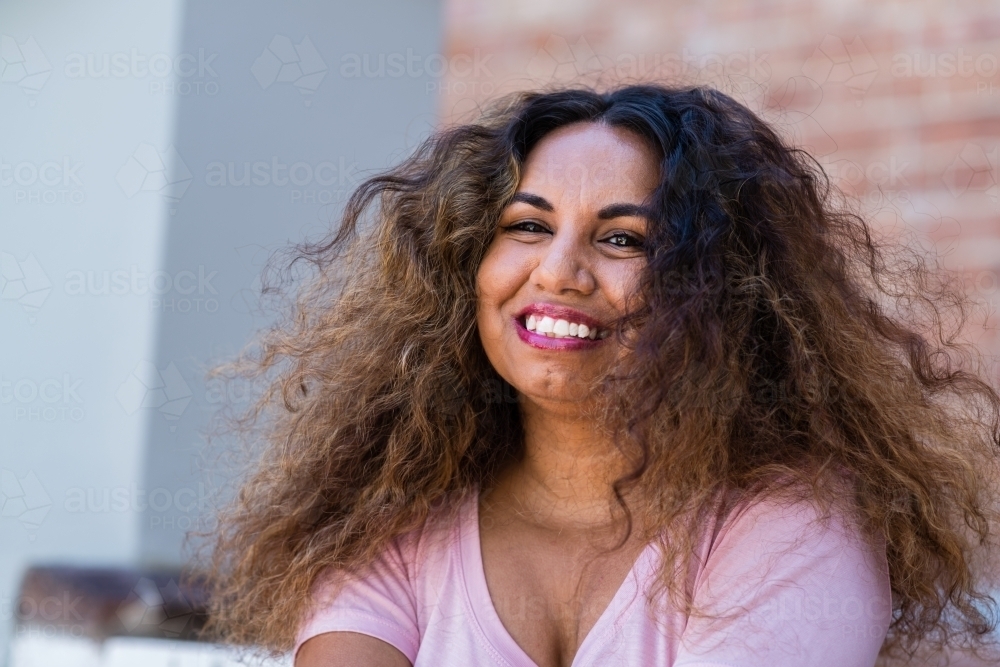 aboriginal woman with curly hair - Australian Stock Image
