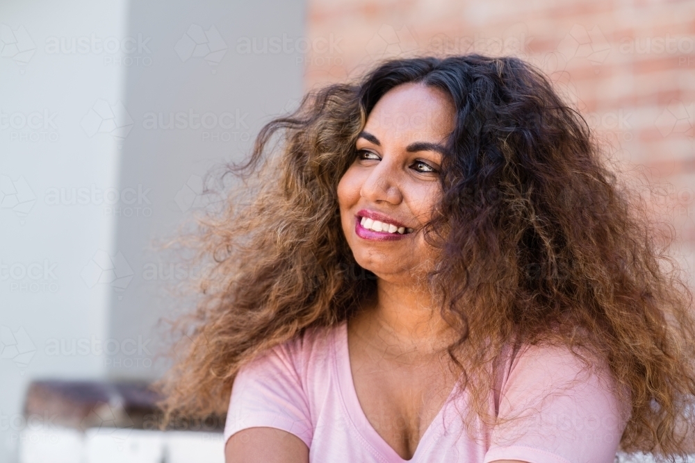 aboriginal woman with curly hair - Australian Stock Image