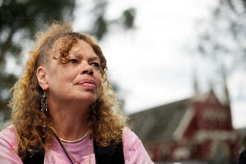 Aboriginal Woman with Pink Top and Black Waistcoat - Australian Stock Image