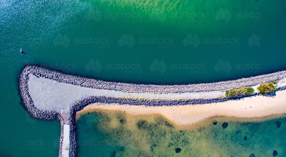 Abstract aerial view of a breakwater structure on Lake Illawarra - Australian Stock Image