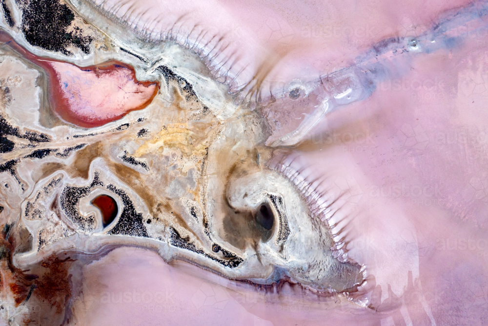 Abstract aerial view of salt lake textures in pink, beige and pink purple tones - Australian Stock Image