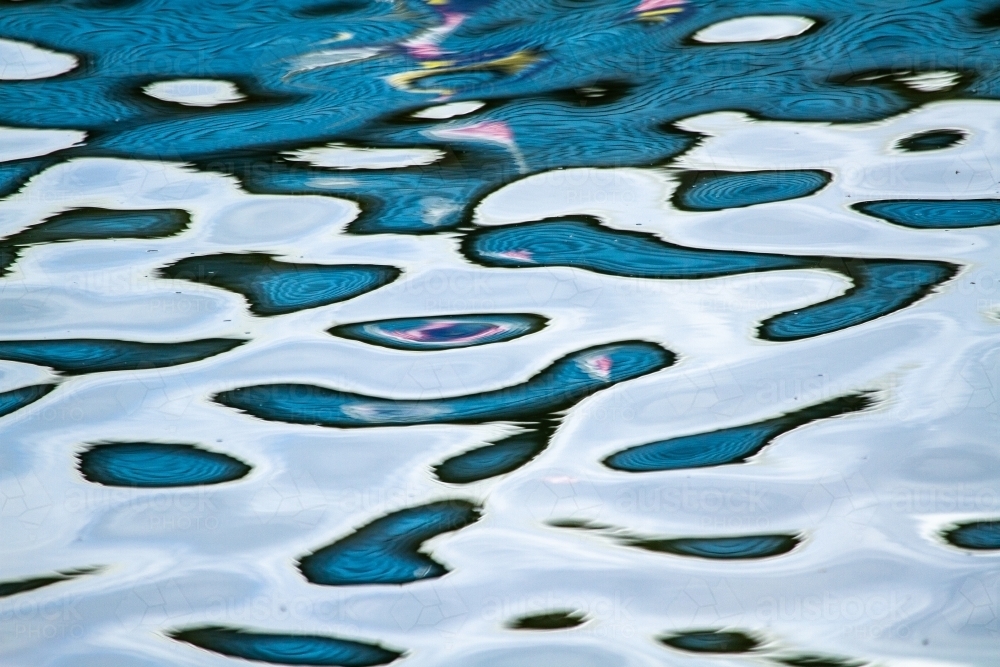 Abstract blue water reflection patterns. - Australian Stock Image