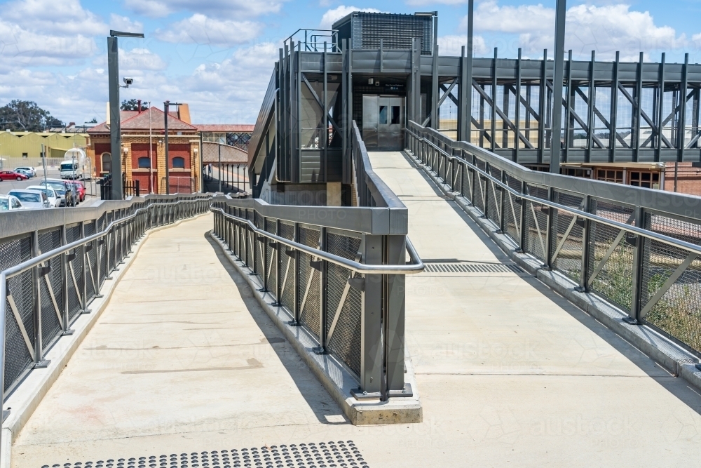 Access ramps and an overhead walkway at a regional railway station - Australian Stock Image