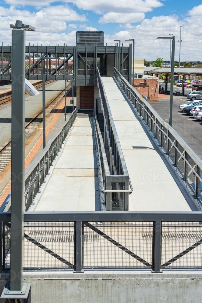 Access ramps and an overhead walkway at a regional railway station - Australian Stock Image