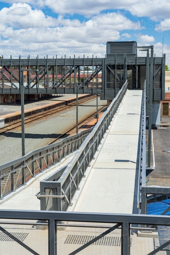 Access ramps and an overhead walkway at a regional railway station - Australian Stock Image