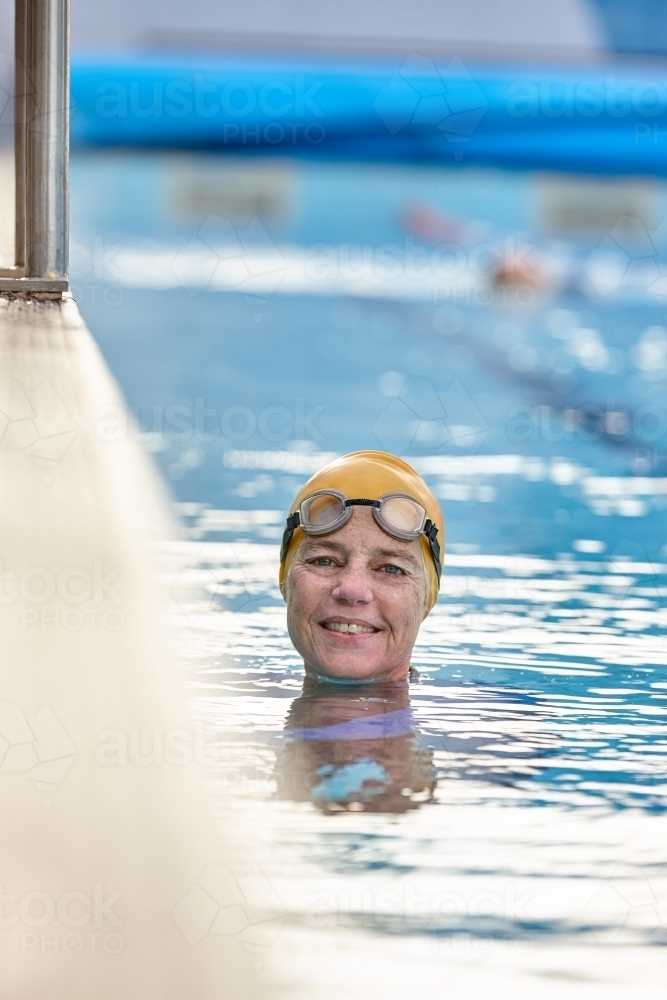 Active senior lady in swimming pool - Australian Stock Image
