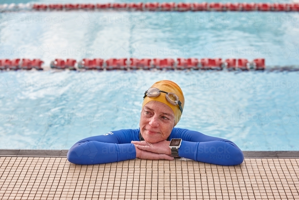 Active senior lady in swimming pool - Australian Stock Image