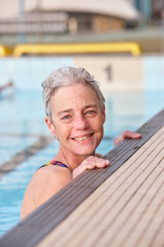 Active senior lady in swimming pool - Australian Stock Image