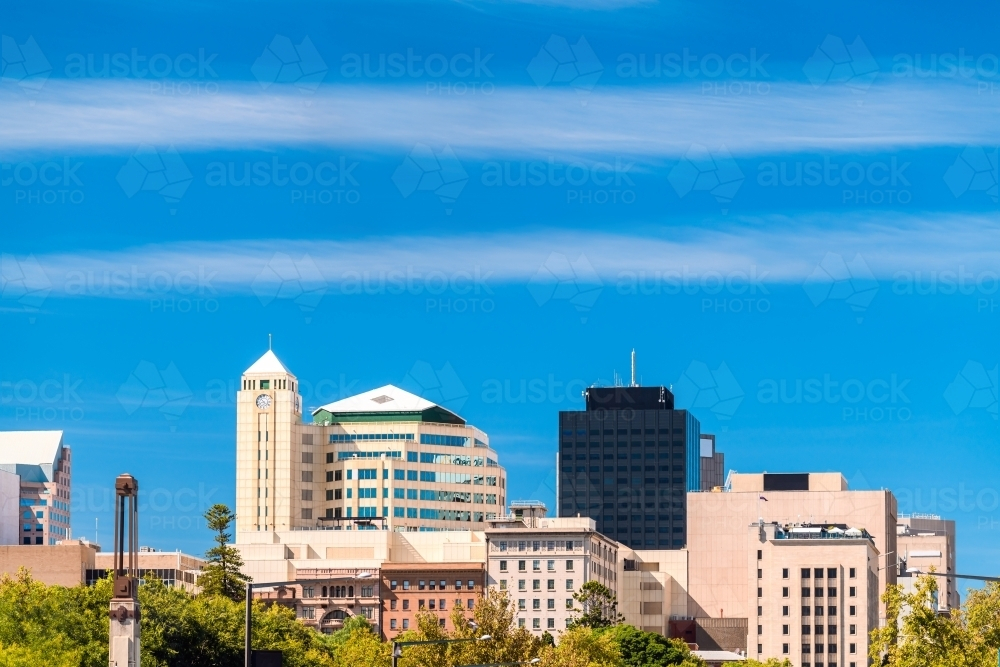Adelaide CBD skyline viewed from King William street on a bright day against blue sky - Australian Stock Image