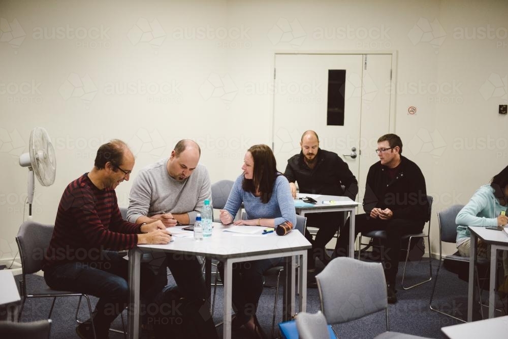 Image of Adult students at a small group tutorial at university ...
