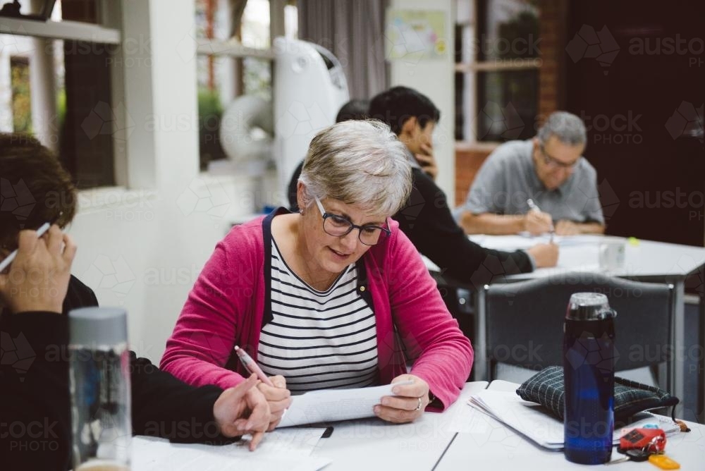 Adult students studying together at University - Australian Stock Image
