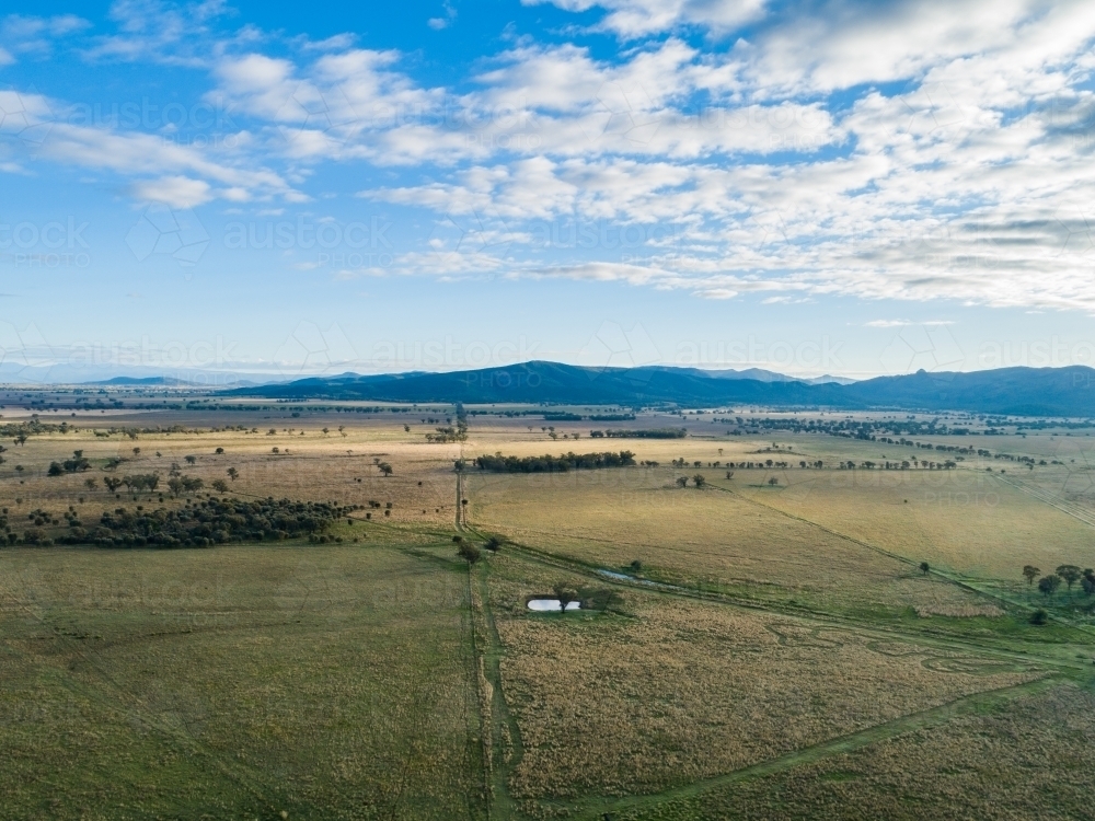 Aerial Australian farm landscape with dam and paddocks - Australian Stock Image