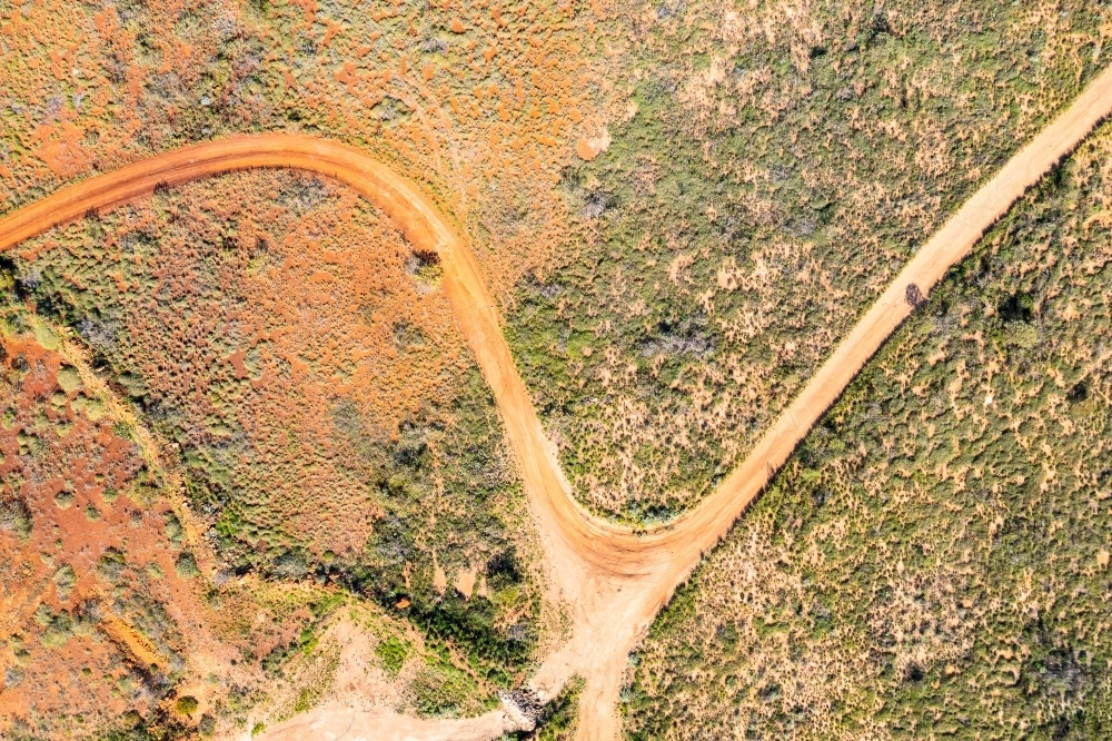 aerial drone photo looking down onto track in coastal area in the Pilbara - Australian Stock Image