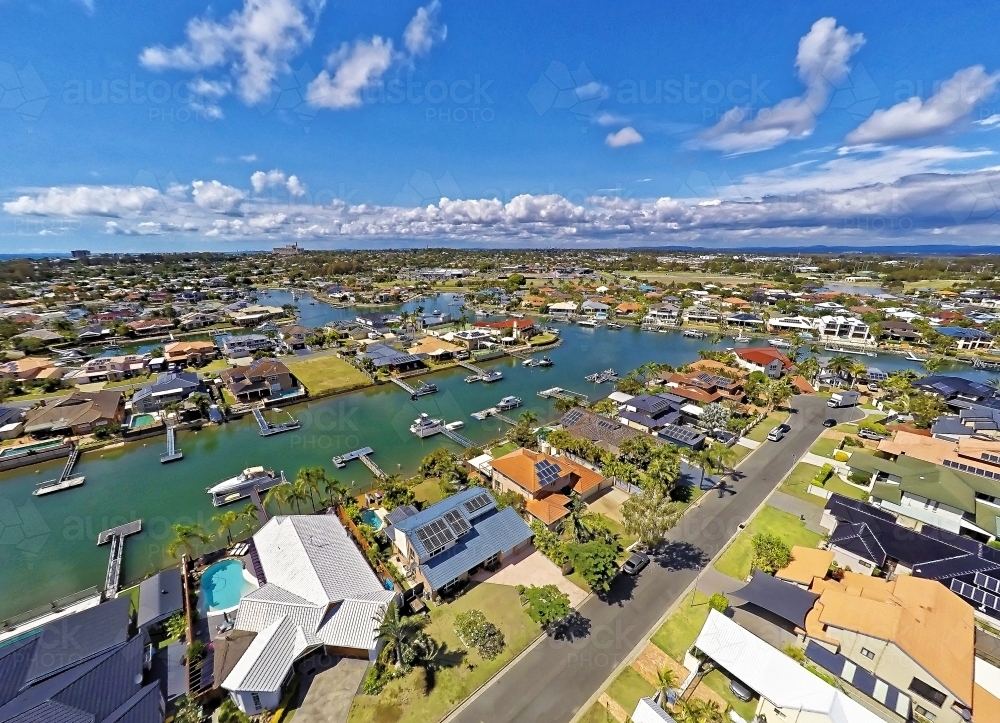 Aerial drone uav footage over waterfront properties with private jetties and solar panels in Newport - Australian Stock Image
