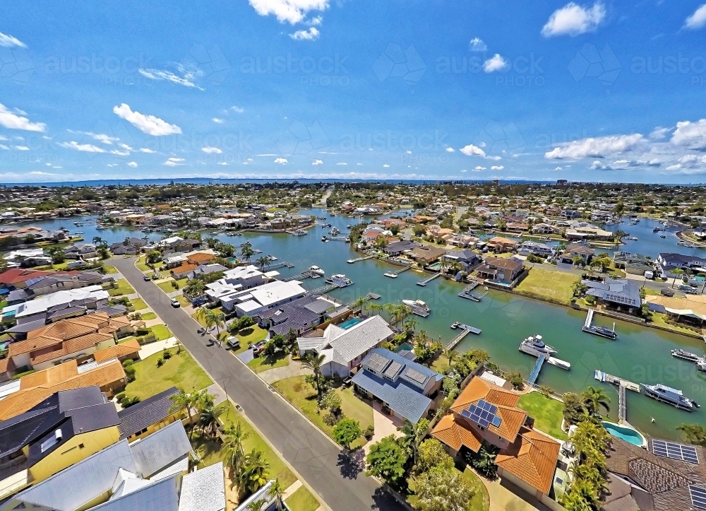 Aerial drone uav footage over waterfront properties with private jetties and solar panels in Newport - Australian Stock Image