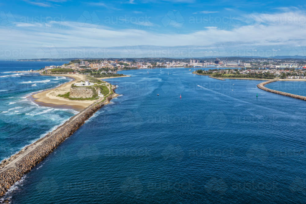 Aerial drone view of Nobbys Lighthouse and breakwall with Newcastle harbour - Australian Stock Image