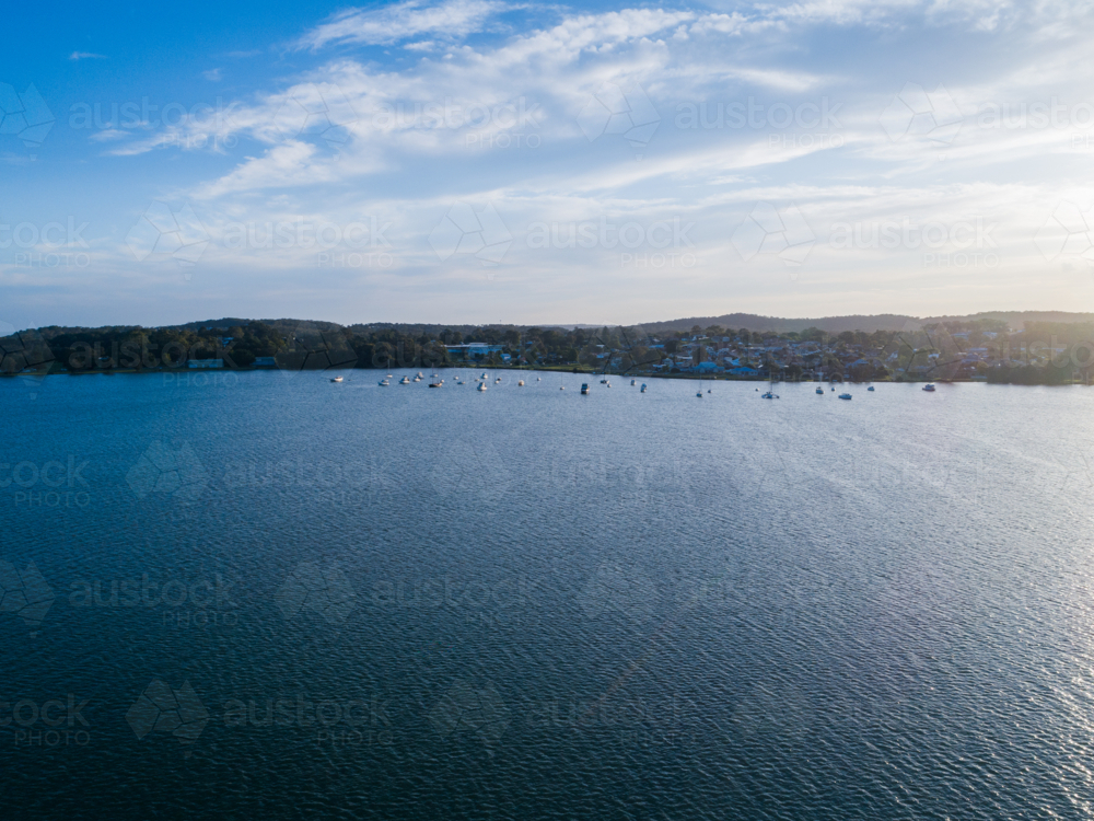 Image of Aerial drone view of pleasure craft boats moored on distant ...