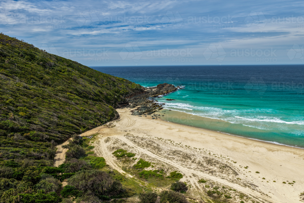Aerial drone view of Seven Mile Beach in Forster showcasing a long stretch of sandy shoreline. - Australian Stock Image