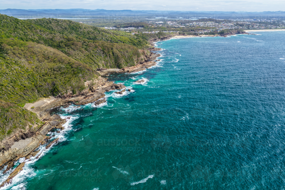 Aerial drone view over McBrides rockpool showing the natural rock formation along a rugged coastline - Australian Stock Image