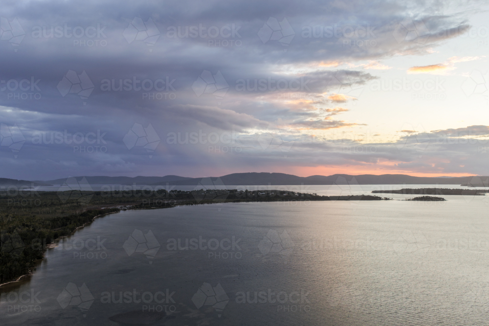 Aerial drone view over Pipers Bay in Forster, New South Wales, Australia with cloudy sky. - Australian Stock Image