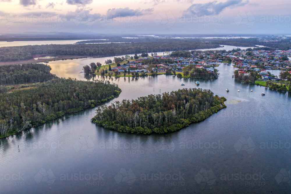 Aerial image capturing the Coolongolook River in Tuncurry at sun set - Australian Stock Image